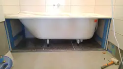 Installation of a bathtub in the bathroom photo