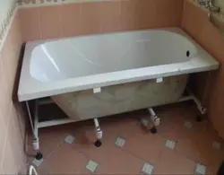 Installation of a bathtub in the bathroom photo