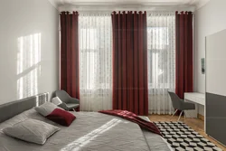 Burgundy curtains in the bedroom interior