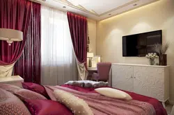 Burgundy curtains in the bedroom interior