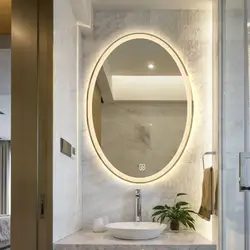 Oval mirror in the bath photo