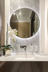 Oval mirror in the bath photo